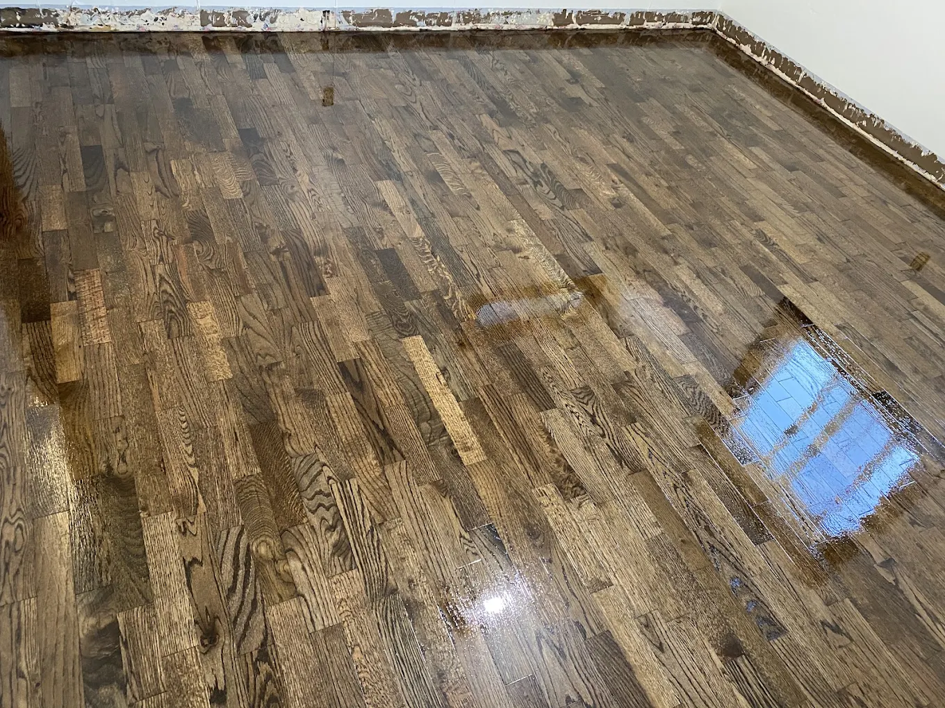 Hardwood floor drying after repairs and refinishing in a Portland home