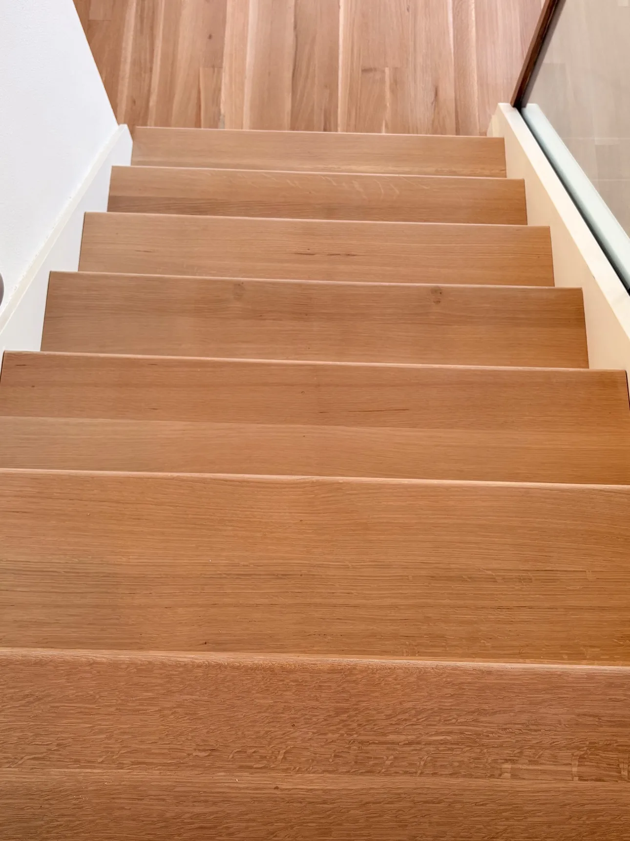 Finished solid oak stair treads and red oak patch in Portland home